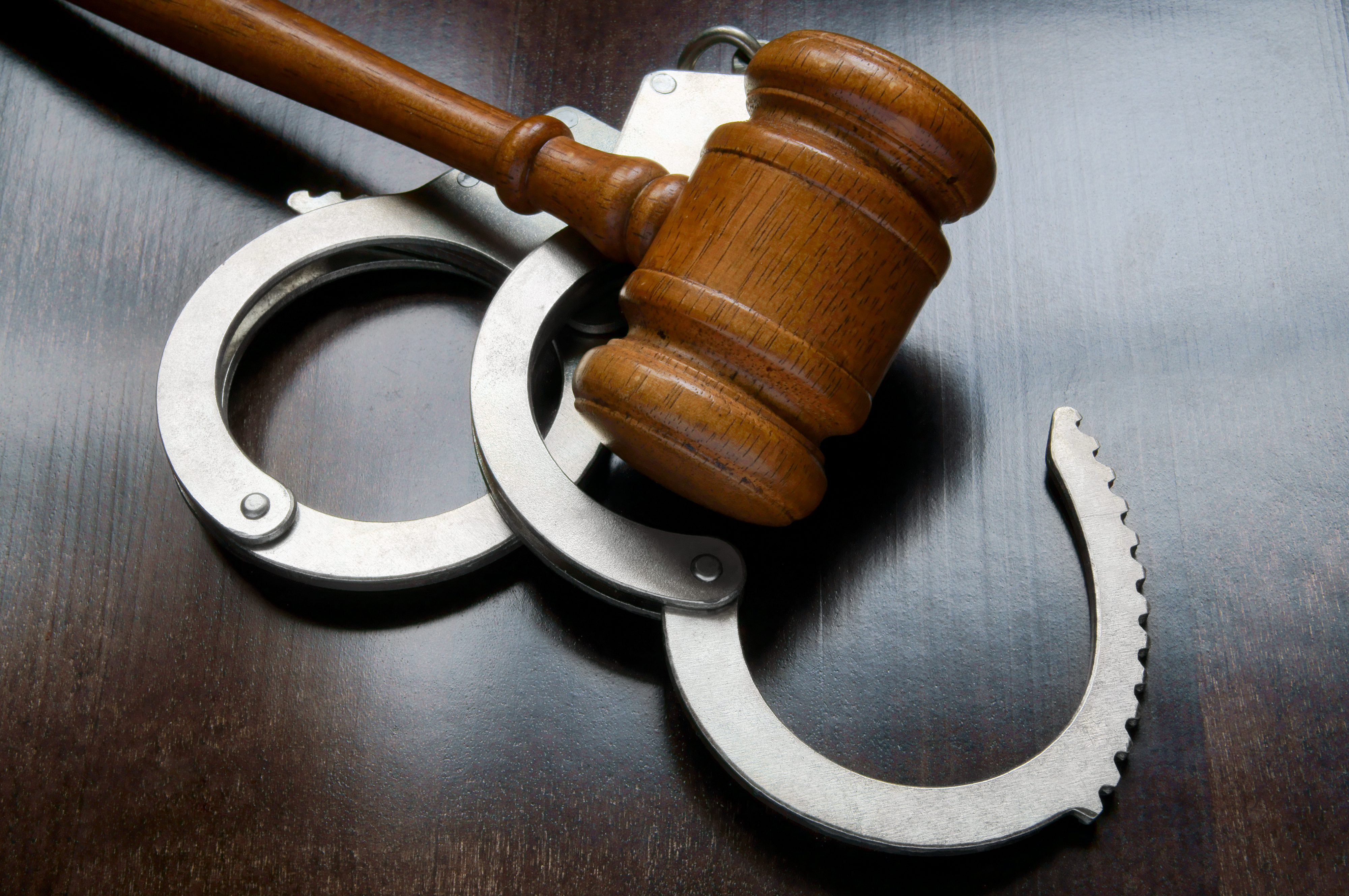 Gavel and handcuffs - New York extortion law